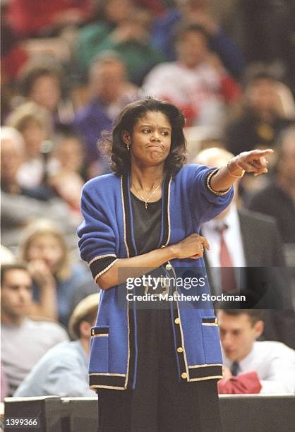 Coach Bernadette Locke-Mattox of the Kentucky Wildcats watches her players during a game against the Georgia Bulldogs at the Stegeman Coliseum in...