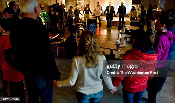 January, 31:Folks gather to pray at Ebenezers Coffeehouse with Mark Batterson Tuesday January 31, 2012 in Washington, DC. It was the last day of a...