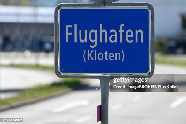 place-name sign airport, zurich kloten, switzerland - wegweiser schweiz stock-fotos und bilder