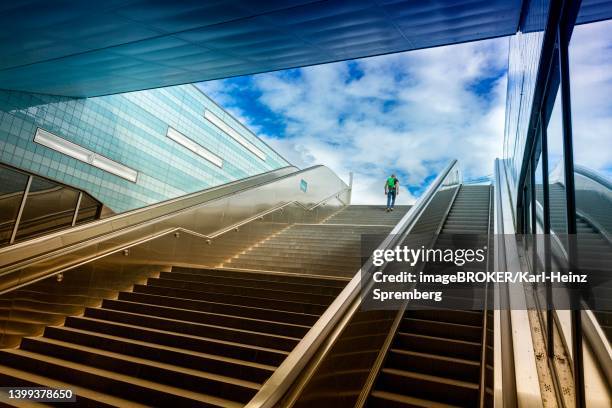 stairs and escalators, ueberseequartier underground station, hamburg, germany - metro hamburg stock-fotos und bilder