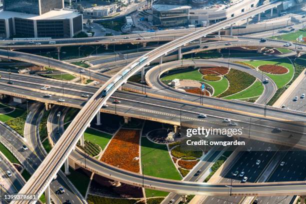 dubai traffic junction in downtown district - dubai metro stock pictures, royalty-free photos & images