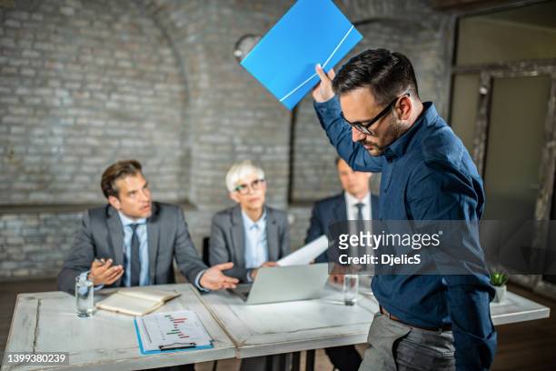 frustrated male candidate leaving a job interview after a rejection. - interview rejection stock pictures, royalty-free photos & images