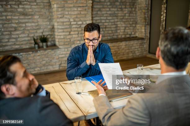 male candidate asking human resource team for a job in the office. - beggar stock pictures, royalty-free photos & images