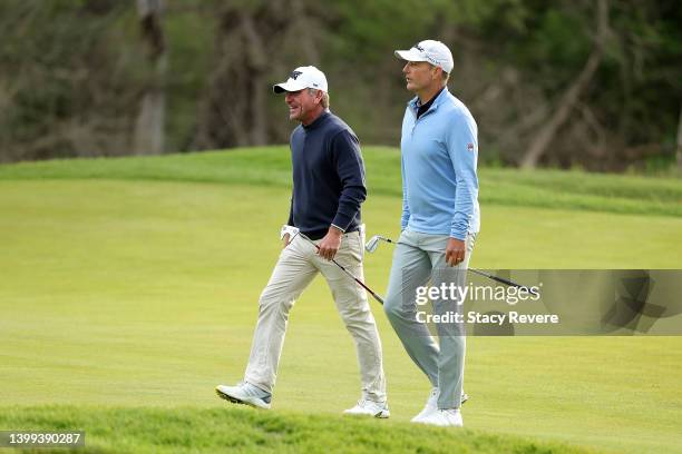 Kevin Baker of Canada and Dave McNabb of the United States walk to the first green during the first round of the Senior PGA Championship presented by...