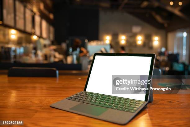 white screen tablet on the table in the coffee shop - email template stock pictures, royalty-free photos & images