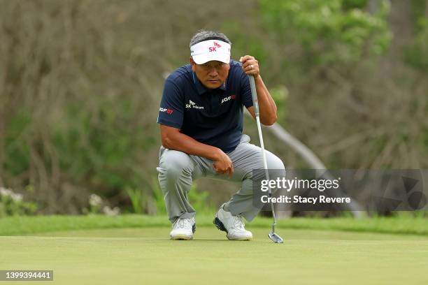 Choi of South Korea lines up a putt on the first green during the first round of the Senior PGA Championship presented by KitchenAid at Harbor Shores...