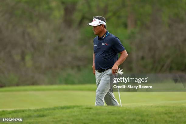 Choi of South Korea walks across the first green during the first round of the Senior PGA Championship presented by KitchenAid at Harbor Shores...