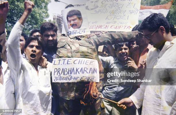 Congress workers carrying an effigy of the Sri Lankan Liberation Tigers of Tamil Ellam leader Prabhakaran demanding his death for his involvement...