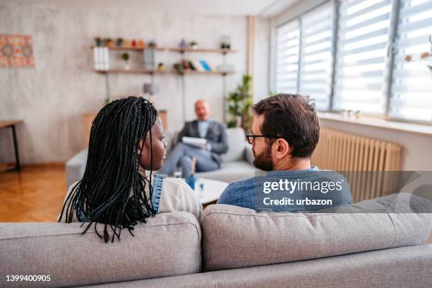 young couple going to marriage counseling - married doctor stock pictures, royalty-free photos & images