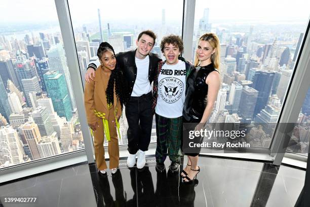 Priah Ferguson, Noah Schnapp, Gaten Matarazzo and Cara Buono of the Stranger Things cast visit The Empire State Building on May 26, 2022 in New York...