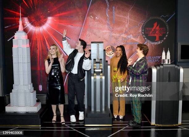Cara Buono, Noah Schnapp, Priah Ferguson and Gaten Matarazzo of the Stranger Things cast participate in a lighting ceremony at the Empire State...