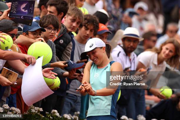Iga Swiatek of Poland signs autographs following the match against Alison Riske of USA during the Women's singles Second Round on Day Five of the...