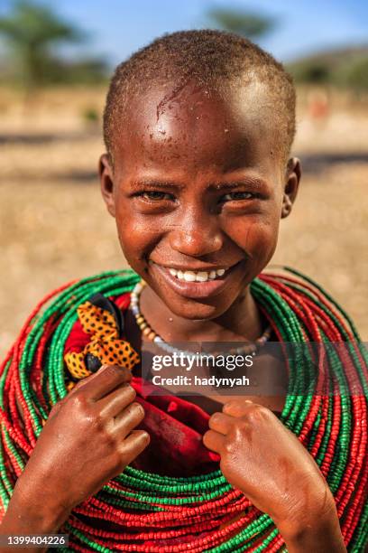 happy african girl on savannah, east africa - native african girls stock pictures, royalty-free photos & images