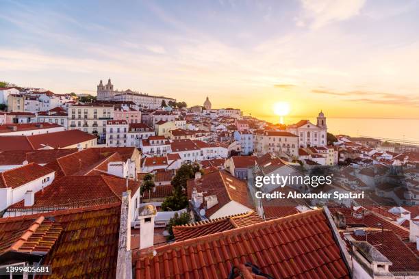 lisbon skyline with rooftops of alfama district at sunrise, portugal - lisboa bildbanksfoton och bilder