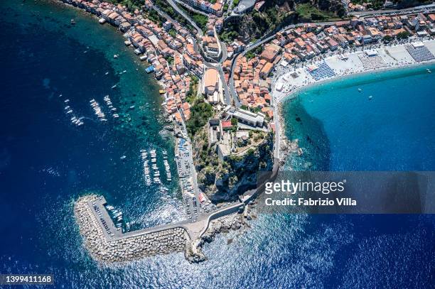 Aerial view, from a helicopter, of the beach and the Ruffo Castle of Scilla, or Castello Ruffo di Calabria an ancient fortification located on a...
