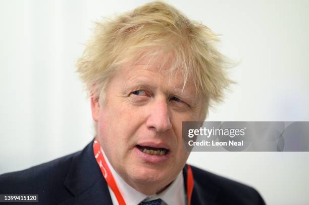 Prime Minister Boris Johnson speaks with students as he makes a constituency visit to the West London Institute of Technology on May 26, 2022 in...
