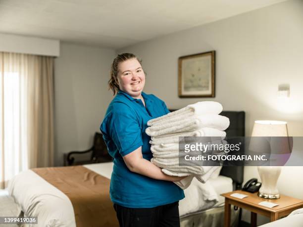 portrait of female hotel housekeeper - hotel housekeeping stock pictures, royalty-free photos & images