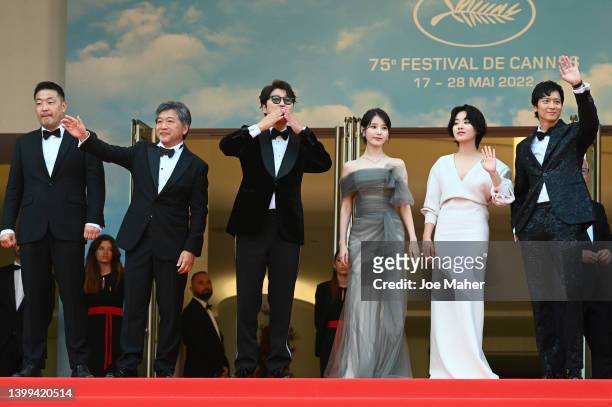Hirokazu Koreeda, Atsuhiro Miura, Ji-eun Lee, Tang Wei, IU and Dong-won Gang attend the screening of "Broker " during the 75th annual Cannes film...