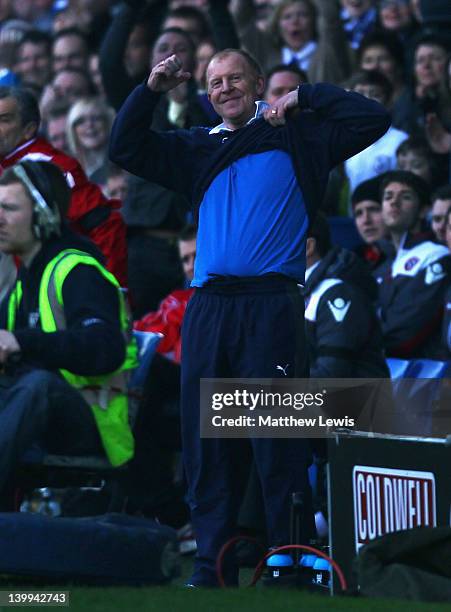 Gary Megson, manager of Sheffield Wednesday shows the Sheffield United fans the color of the team he is supporting during the npower League One match...