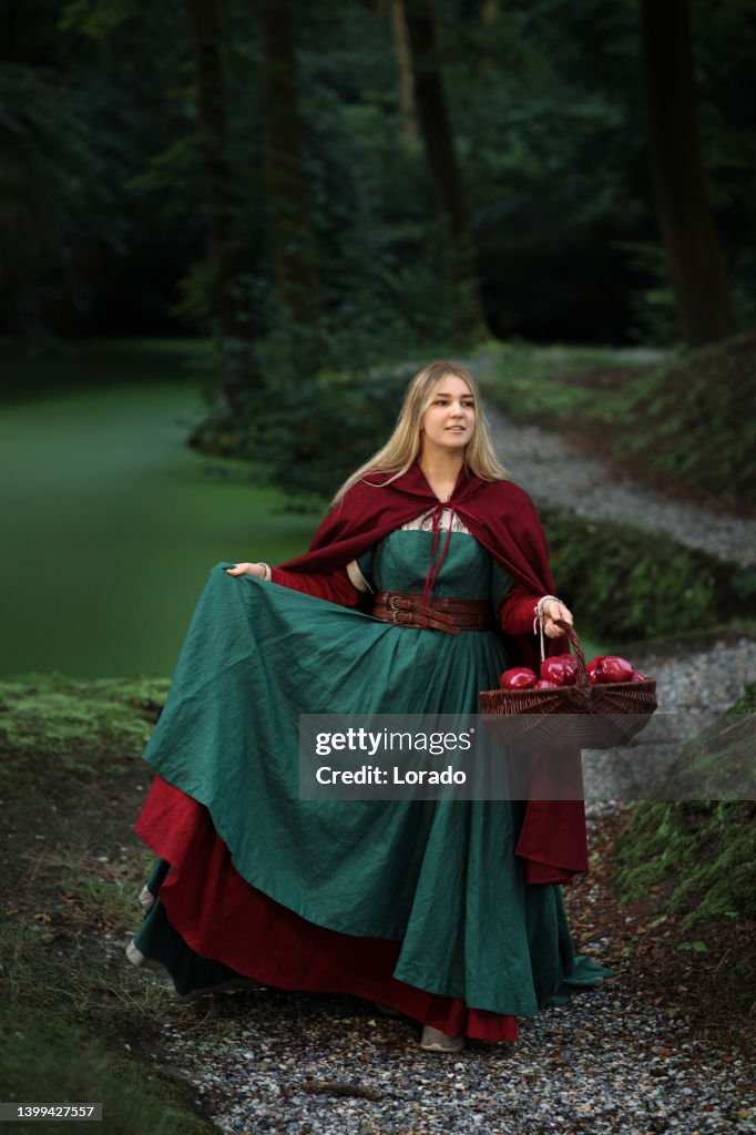 Beautiful Rod Riding Beautiful Little Red Riding Hood Female In A Forest High-Res Stock ...