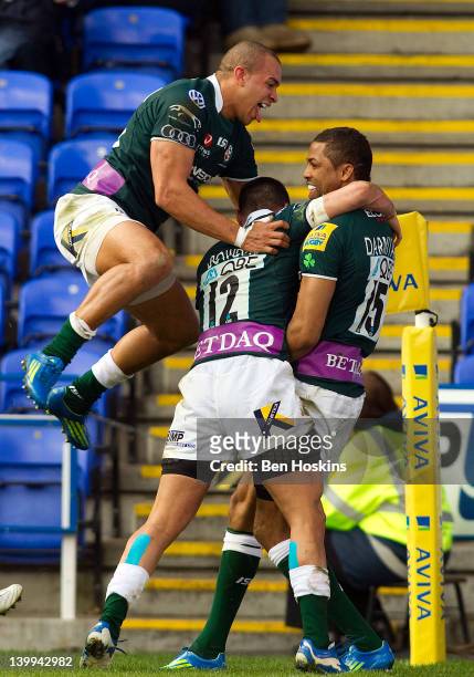 Delon Armitage of London Irish celebrates with team mates after scoring his team's first try of the game during the Aviva Premiership match between...
