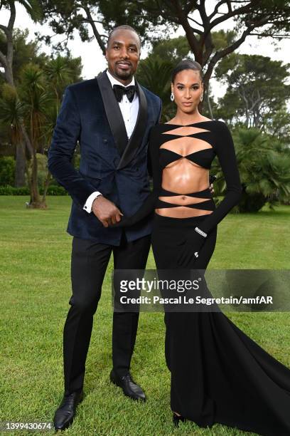 Serge Ibaka and Cindy Bruna pose during the amfAR Cannes Gala 2022 at Hotel du Cap-Eden-Roc on May 26, 2022 in Cap d'Antibes, France.