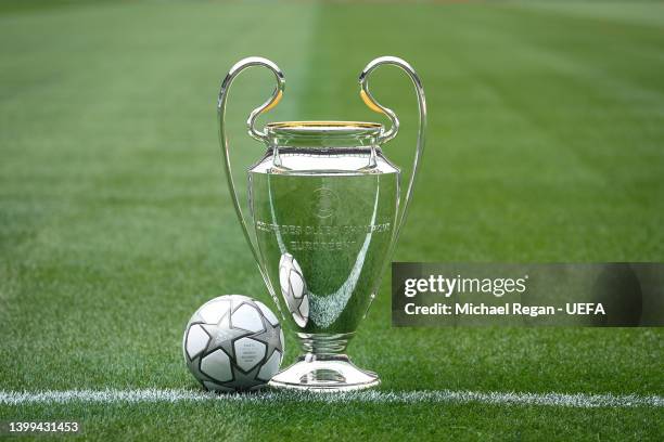 The Champions League trophy is seen with the official match ball of the final ahead of the 2022 UEFA Champions League Final on May 26, 2022 in Paris,...