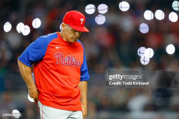 Manager, Joe Girardi of the Philadelphia Phillies returns to the dugout after a pitching change during the fifth inning against the Atlanta Braves at...
