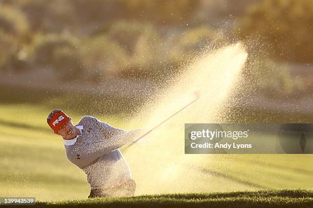 Hunter Mahan hits an approach shot from a bunker on the second hole during the semifinal round of the World Golf Championships-Accenture Match Play...