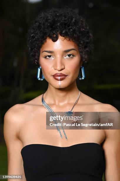 Indya Moore poses during the amfAR Cannes Gala 2022 at Hotel du Cap-Eden-Roc on May 26, 2022 in Cap d'Antibes, France.