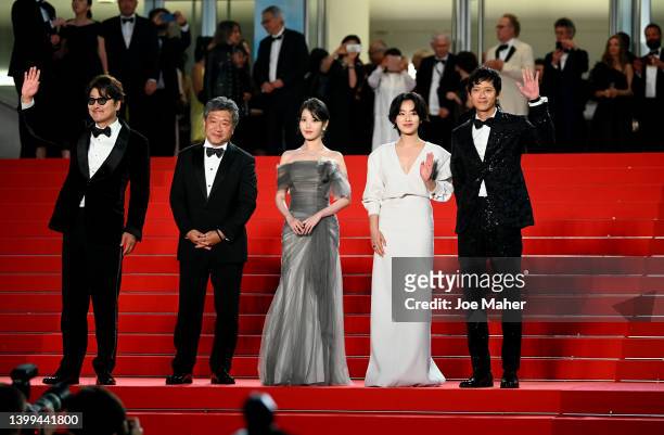 Song Kang-Ho, Director Hirokazu Koreeda, Lee Ji-eun, Joo-Young Lee and Dong-won Gang depart the screening of "Broker " during the 75th annual Cannes...