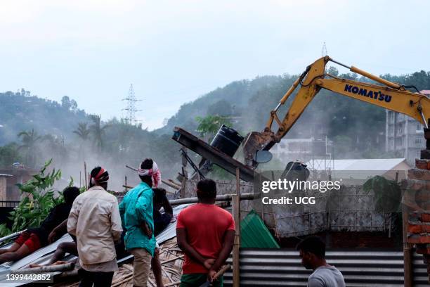 District administration officials demolish illegally constructed house during an eviction drive, at Borbari in Guwahati, India Friday, May 13, 2022.