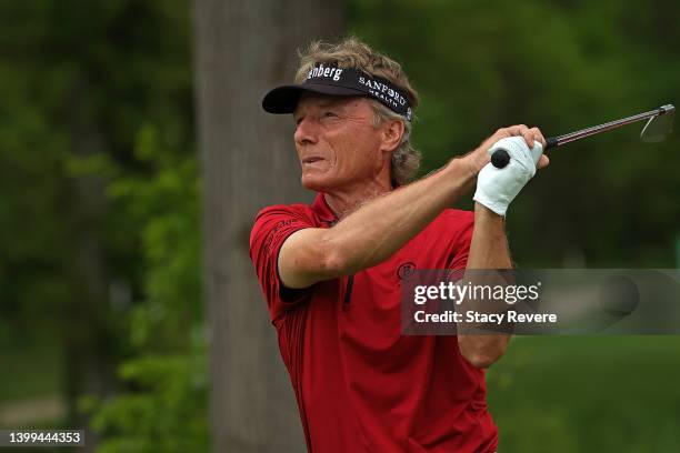 Bernhard Langer of Germany watches his tee shot on the 11th hole during the first round of the Senior PGA Championship presented by KitchenAid at...