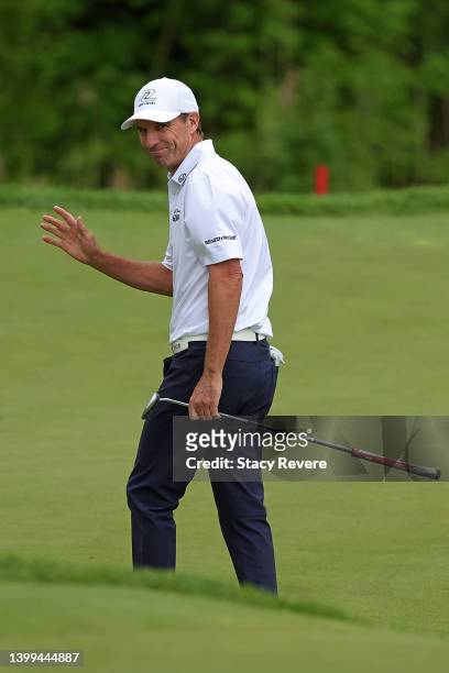 Steven Alker of New Zealand waves to the crowd following an eagle on the 10th hole during the first round of the Senior PGA Championship presented by...