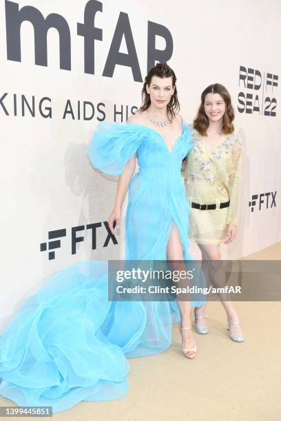 Milla Jovovich and Ever Gabo Anderson attend the amfAR Gala Cannes 2022 at Hotel du Cap-Eden-Roc on May 26, 2022 in Cap d'Antibes, France.