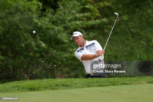 Robert Karlsson of Sweden hits from a green side bunker on the 10th hole during the first round of the Senior PGA Championship presented by...