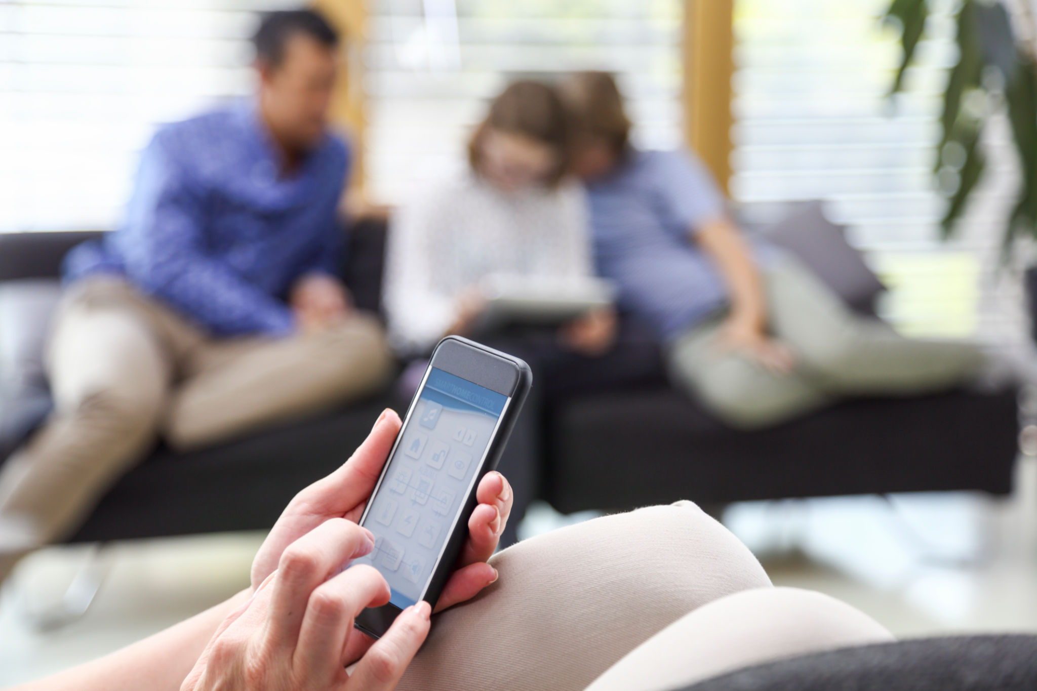 family using smart home app