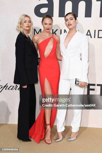 Stella Maxwell, Candice Swanepoel and Valentina Sampaio attend the amfAR Cannes Gala 2022 at Hotel du Cap-Eden-Roc on May 26, 2022 in Cap d'Antibes,...