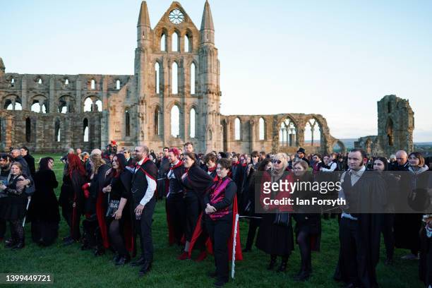 People dressed as vampires gather to wait for the result during a world record attempt for the largest gathering of vampires in one place at Whitby...