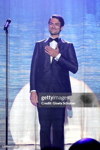 Matteo Bocelli sings during the amfAR Cannes Gala 2022 at Hotel du Cap-Eden-Roc on May 26, 2022 in Cap d'Antibes, France.