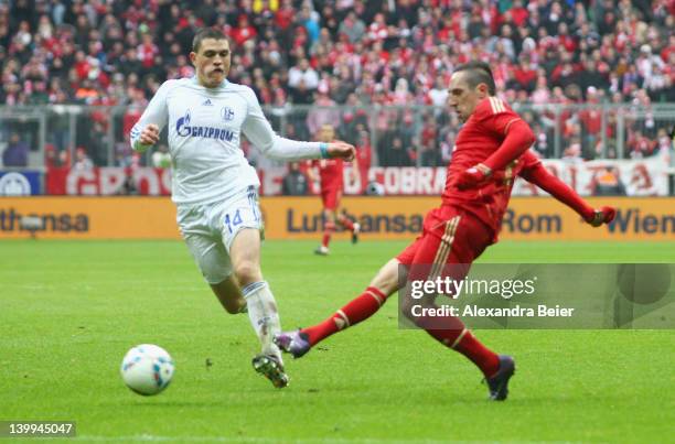 Franck Ribery of Bayern Muenchen scores his first goal against Kyriakos Papadopoulos of Schalke during the Bundesliga match between FC Bayern...