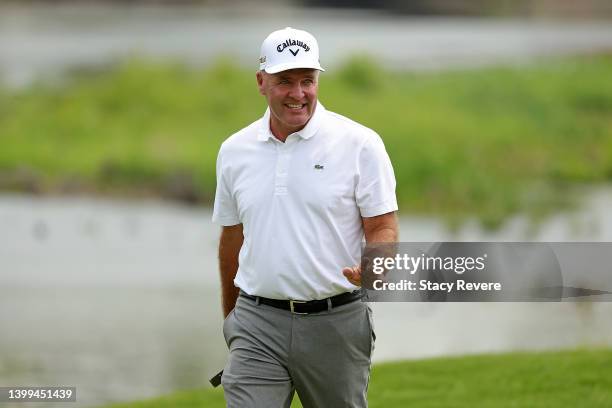 Thomas Levet of France waves to the crowd on the 18th hole during the first round of the Senior PGA Championship presented by KitchenAid at Harbor...