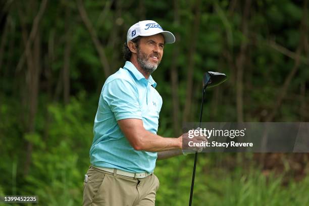 Mark Hensby of Australia hits his tee shot on the 15th hole during the first round of the Senior PGA Championship presented by KitchenAid at Harbor...