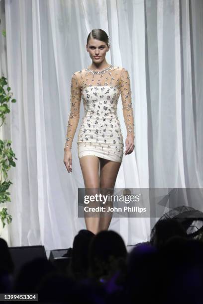 Madison Headrick walks the runway in the fashion show during the amfAR Cannes Gala 2022 at Hotel du Cap-Eden-Roc on May 26, 2022 in Cap d'Antibes,...