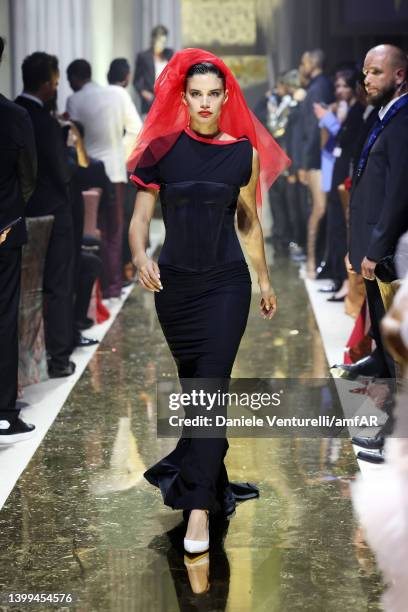 Sara Sampaio walks the runway in the fashion show during the amfAR Cannes Gala 2022 at Hotel du Cap-Eden-Roc on May 26, 2022 in Cap d'Antibes, France.