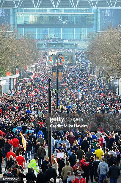 Fans walk along Olympic Way prior to the Carling Cup Final match between Liverpool and Cardiff City at Wembley Stadium on February 26, 2012 in...