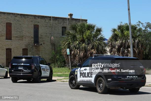 Uvalde police cars are seen near City Hall on May 26, 2022 in Uvalde, Texas. Nineteen children and two adults were killed at Robb Elementary School...