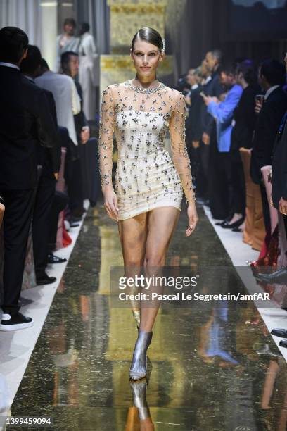 Madison Headrick walks the runway in the fashion show during the amfAR Cannes Gala 2022 at Hotel du Cap-Eden-Roc on May 26, 2022 in Cap d'Antibes,...
