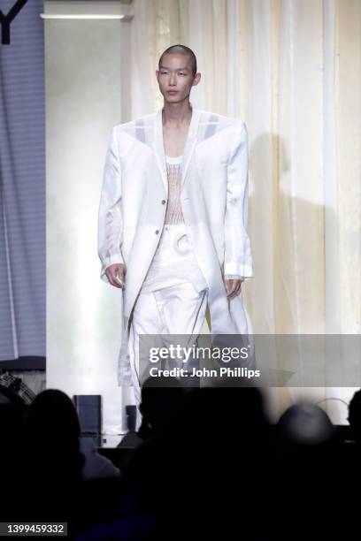 Model walks the runway in the fashion show during the amfAR Cannes Gala 2022 at Hotel du Cap-Eden-Roc on May 26, 2022 in Cap d'Antibes, France.