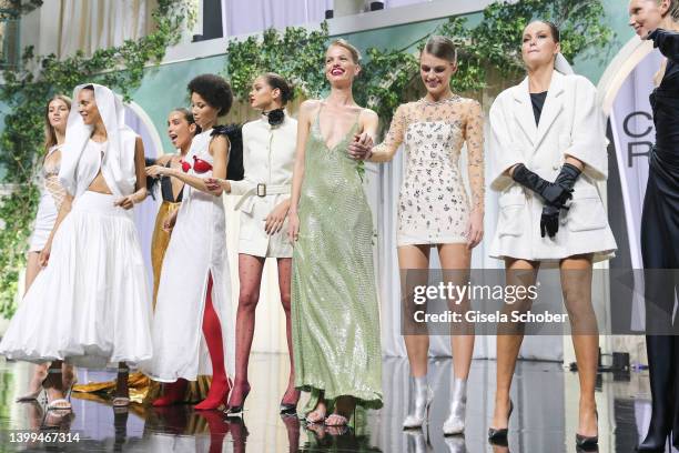 Models walk the runway in the fashion show during the amfAR Cannes Gala 2022 at Hotel du Cap-Eden-Roc on May 26, 2022 in Cap d'Antibes, France.